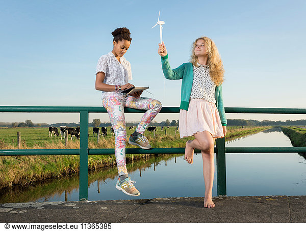 Children using miniature wind turbine to power digital tablet  Breda  Netherlands