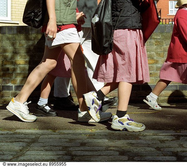 Children walking to school  not travelling by car and therefore cutting down on pollution and carbon dioxide emissions  United Kingdom.