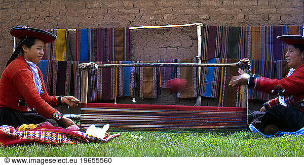 CHINCHERO  PERU-- Weavers prepare a loom for weave at the Center for Traditional Textiles of Cusco's Chinchero branch.