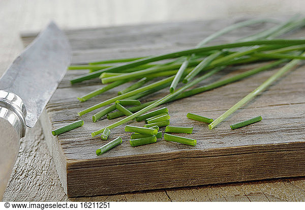 Chives on chopping board