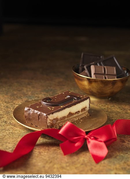 Chocolate dessert slice with letter J