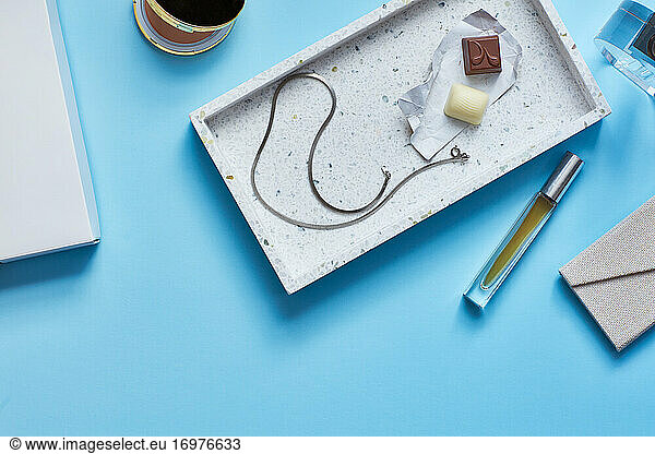 Chocolates  necklace  perfume on Turquoise surface