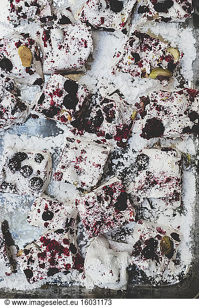 Christmas baking  close up of slices of a traybake with berries and nuts.