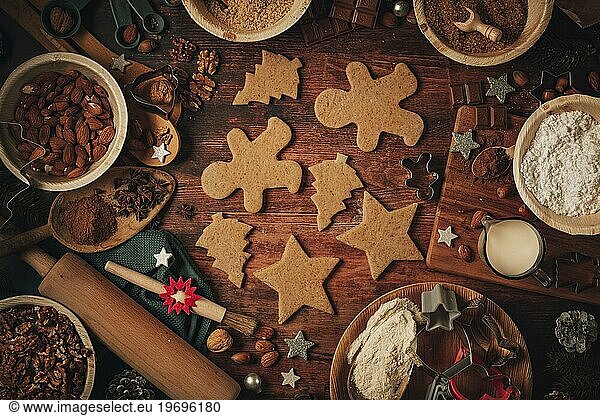 Christmas biscuit cut-outs  baking ingredients  Christmas decorations  flour  sugar  almonds  nuts  cinnamon  cookie cutters
