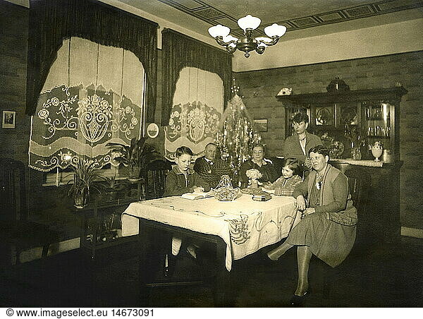 Christmas  Christmas Eve  family celebrating Christmas  presents on the table  Germany  circa 1924