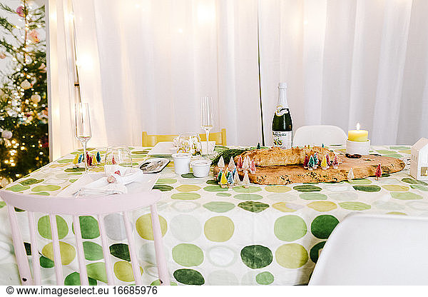 Christmas dinner table at single home with green table circle cloth