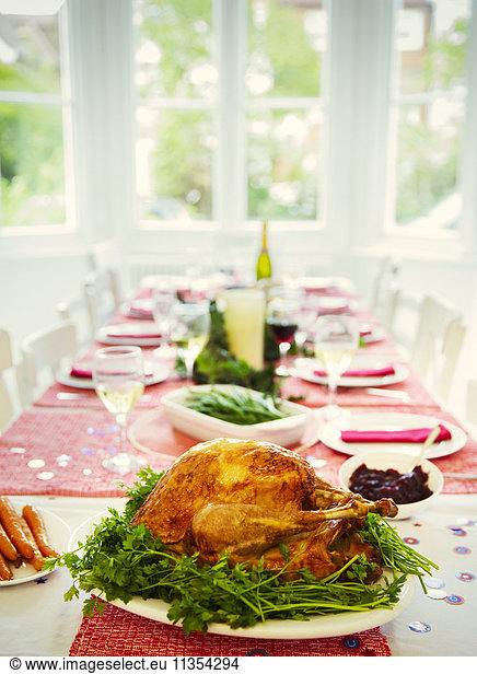Christmas dinner turkey and white wine on dining table