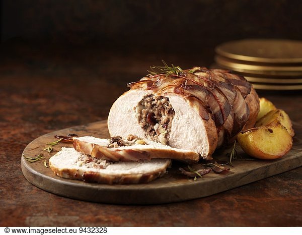 Christmas dinner. Turkey breast with pork  apple & cranberry stuffing and rosemary