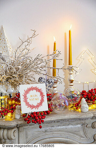 Christmas greeting card and decoration on marble fireplace