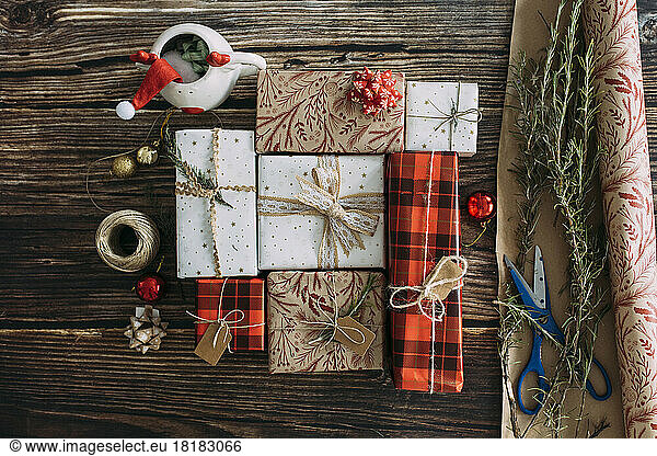 Christmas presents arranged on wooden table
