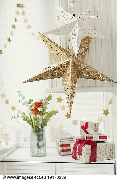 Christmas presents with star decoration at home