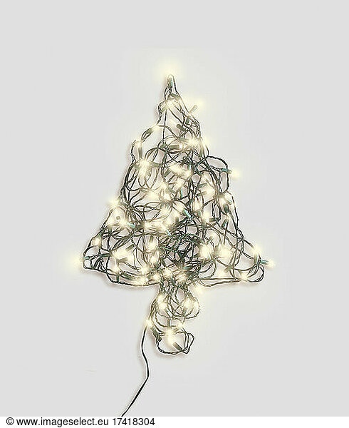 Christmas tree shape made of glowing Christmas lights