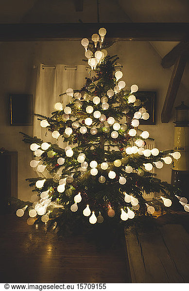 Christmas tree with baubles made of light bulbs