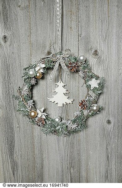 Christmas wreath on wooden wall