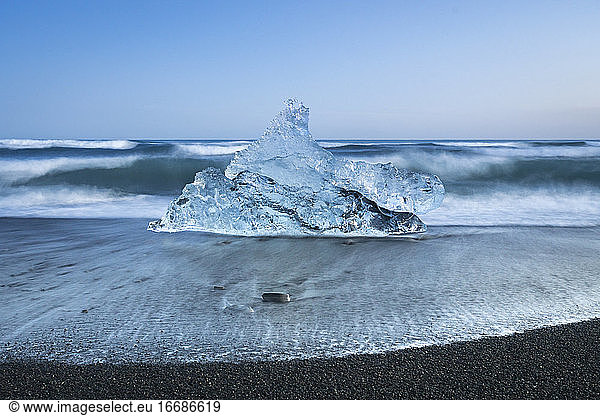 Chunk of ice on sea shore at Diamond beach near Jokulsarlon Glacier Lagoon  Iceland