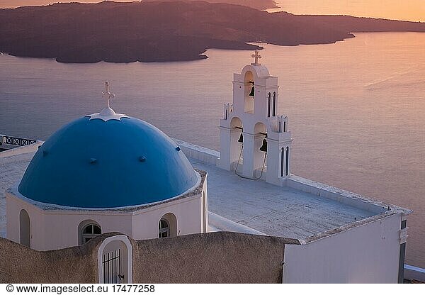 Church with blue dome roof and white three bell tower at the crater rim  behind it the volcanic island Nea Kameni  Firofestani  Thira  Santorini  Cyclades  Aegean Sea  Greece  Europe