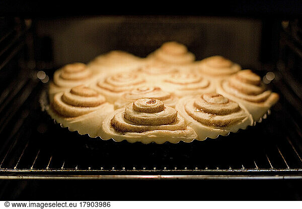Cinnamon buns baking in oven