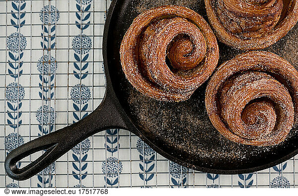Cinnamon roll spirals on cast-iron griddle