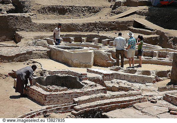 Circular baths outside the northwest perimeter wall of the Precinct of Amun  Each bath seated 16 bathers  with some seats flanked by dolphin statuettes. Egypt. Ancient Egyptian. Ptolemaic period. Karnak.