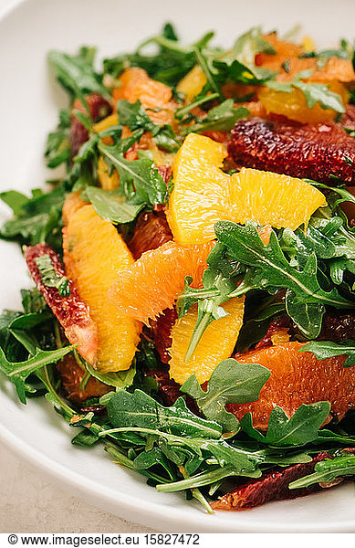 Citrus and arugula salad closeup