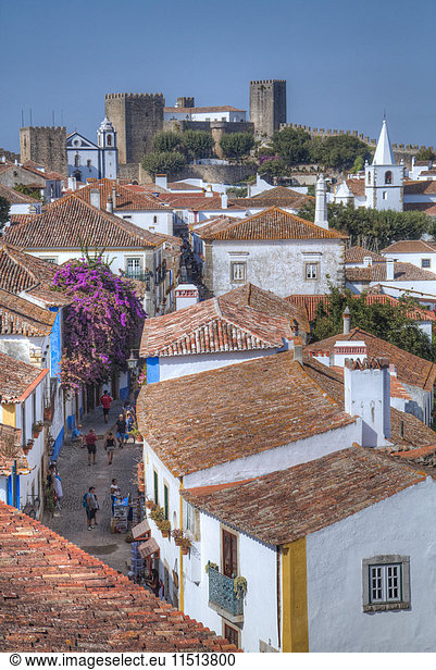 City overview with Medieval Castle in the background  Obidos  Portugal  Europe