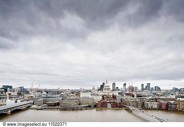City skyline from Tate Modern  with river Thames and millennium bridge  London  UK