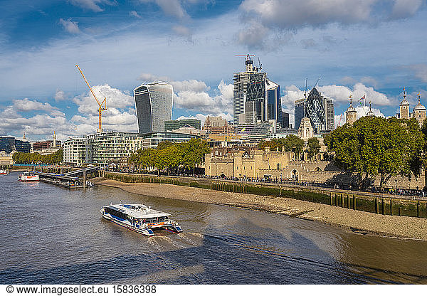 Cityscape of the city of London with a ferry and tower of london