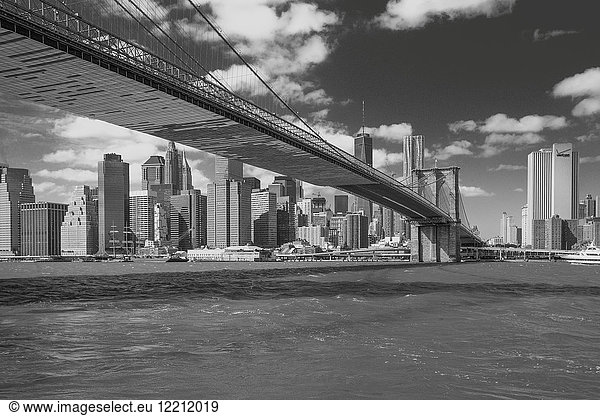Cityscape with Brooklyn Bridge and skyscrapers  B&W  New York  USA
