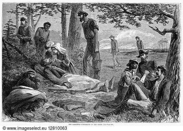 CIVIL WAR: WOUNDED. Volunteers of the Christian Commission give first aid to wounded Union soldiers at a battlefield during the American Civil War. Wood engraving from a Northern American newspaper of 1864.