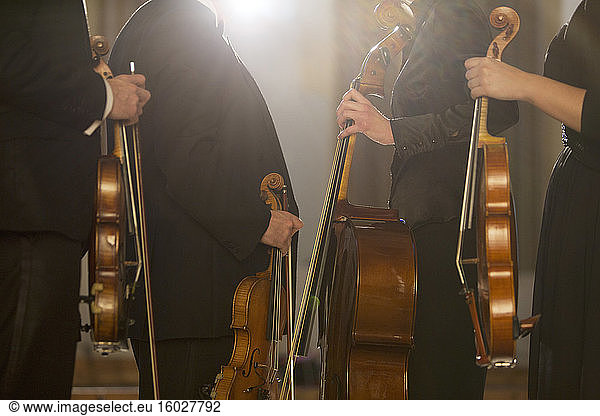 Classical musicians holding instruments