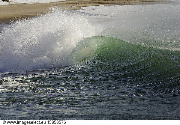 Clean surf crashing on beach in Charlestown Rhode Island