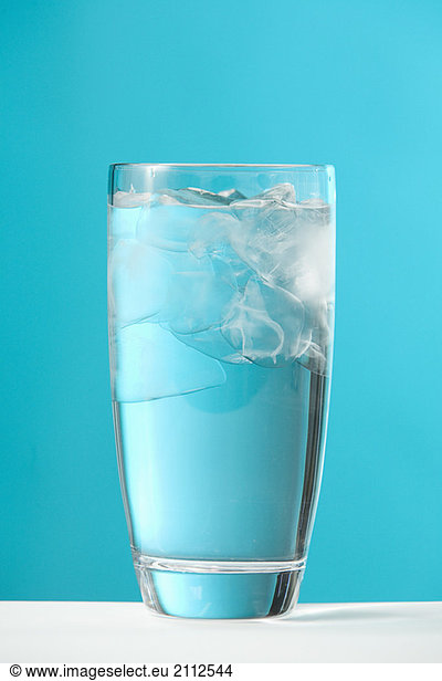 Clear glass of water with ice chips