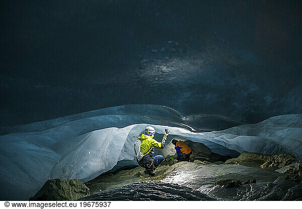 Climate researchers measure temperature in cave below glacier