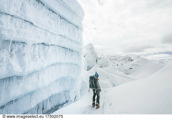 Climber next to an ice wall on Island Peak  Nepal