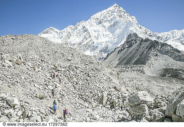 Climbers headed towards Everest  with Everest * Nuptse towering above