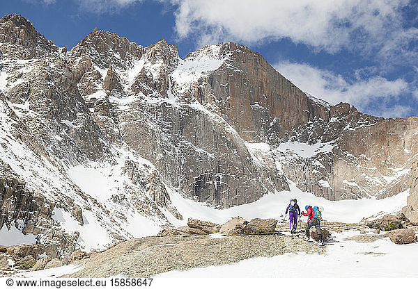 Climbers hike towards Longs Peak in Rocky Mountain National Park