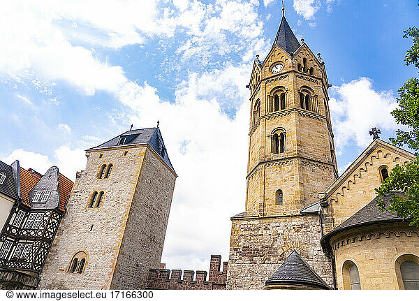 Clock tower of St Nicholas Church against cloudy sky at Eisenach  Germany