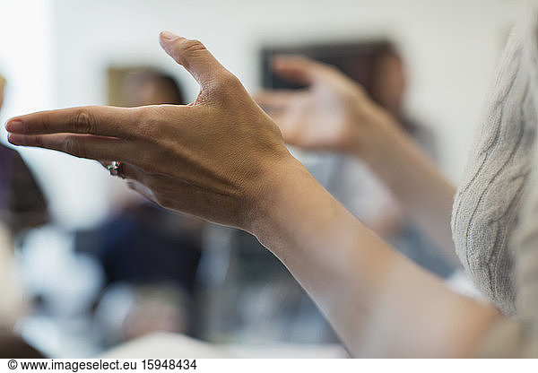 Close up businesswoman gesturing in meeting