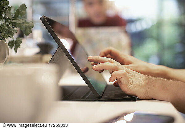 Close up man using digital tablet