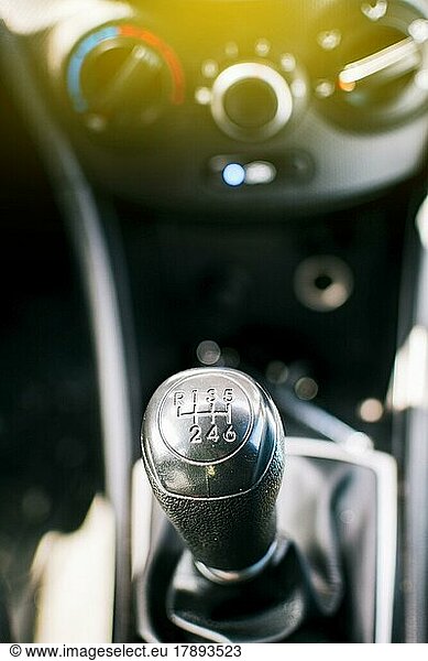 Close up of a car gear knob. Detail view of a vehicle transmission lever  Gear lever of a vehicle. Close-up of a car gear lever