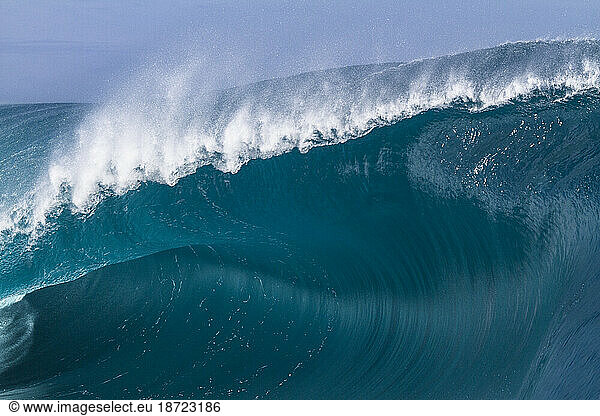 Close up of a huge and powerful wave breaking in Tahiti