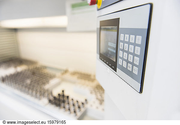 Close-up of a keypad for a machine in factory