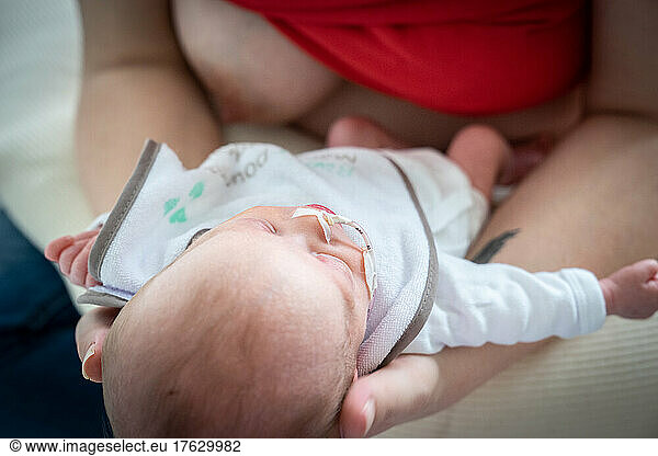 Close-up of a mother who is going to breastfeed her prematurely born newborn baby.