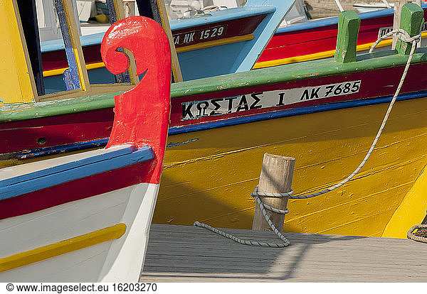 Close up of a row of colorful fishing boats in harbor  Corfu  Greece