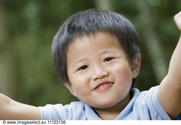 Close up of Asian boy smiling
