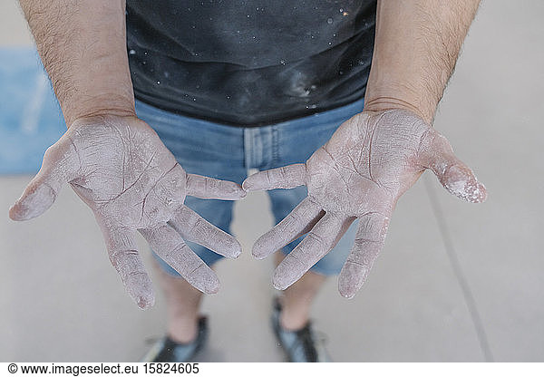 Close-up of athlete with chalk in hands