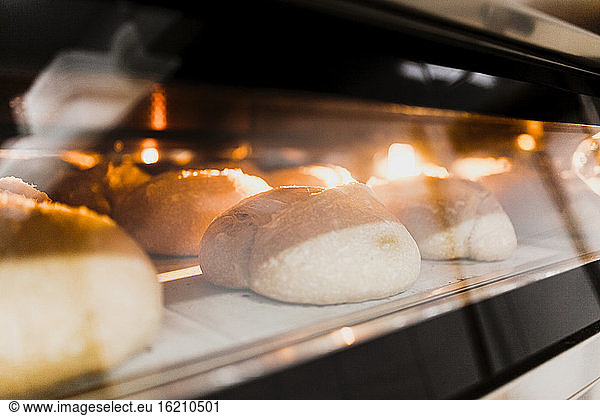 Close-up of baked bread in oven