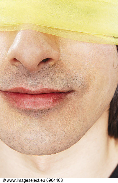Close-up of Blindfolded Man