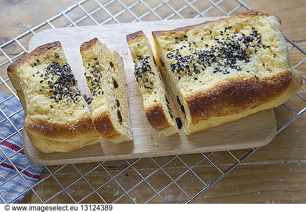 Close-up of bread on cutting board at kitchen counter