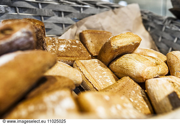 Close-up of breads in basket at supermarket